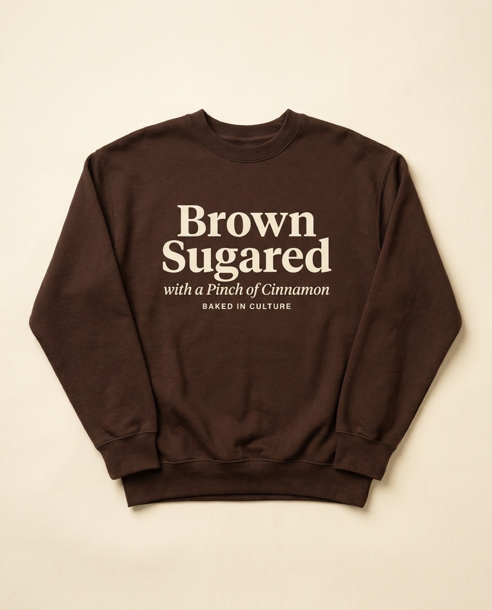 Brown Sugared with a Pinch of Cinnamon sweater — print reads Baked in Culture